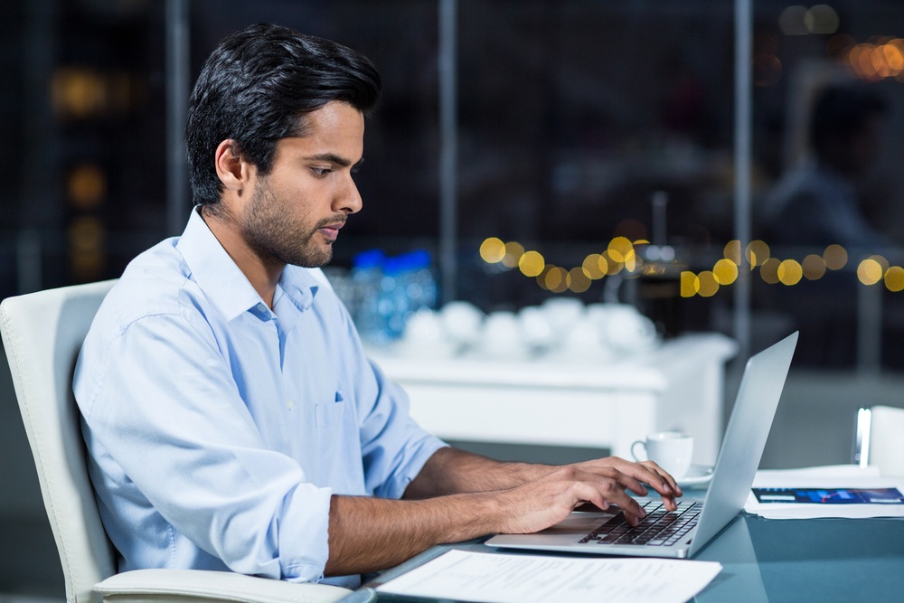 Businessman working on laptop in the office