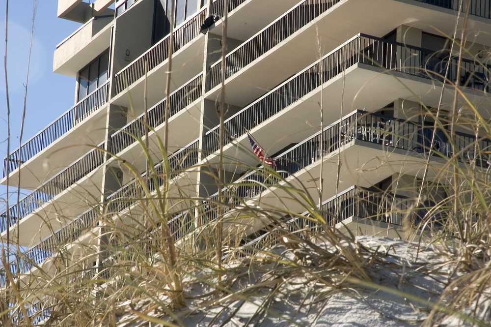 Dune grass and beachfront high-rise-1