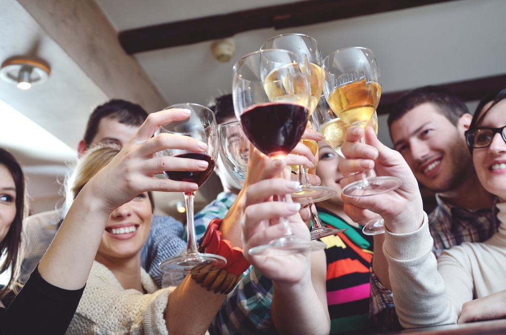 Group of happy young people drink wine  at party disco restaurant.jpeg